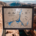 Lake Mead layered bathymetric wood map — Natural Baltic Birch, Charwood (Dark Brown), Hoover Dam scenic background (digital product mockup)