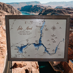 Lake Mead layered bathymetric wood map — Painted Baltic Birch, Barnwood (Rustic Grey), Hoover Dam scenic background (digital product mockup)